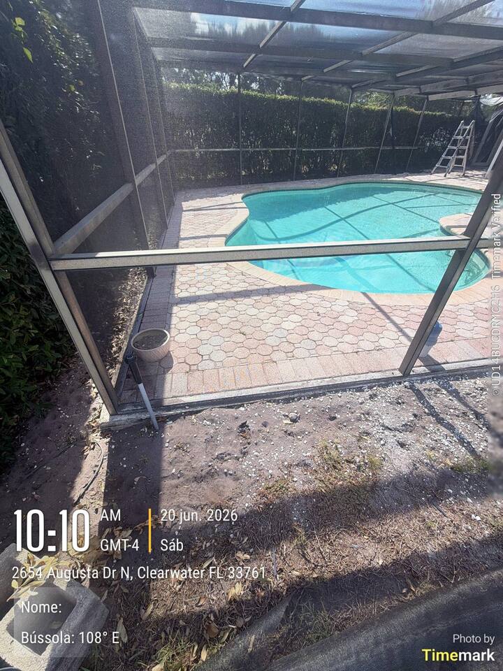 Open pool enclosure panel in Clearwater before repair