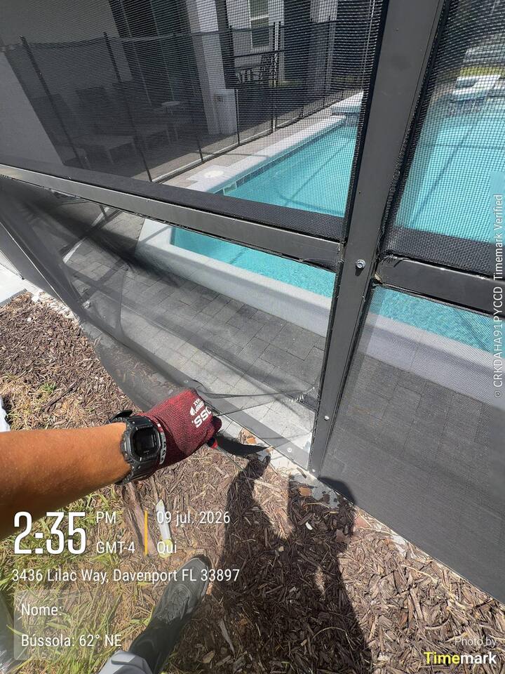 Torn pool enclosure panel in Davenport before repair