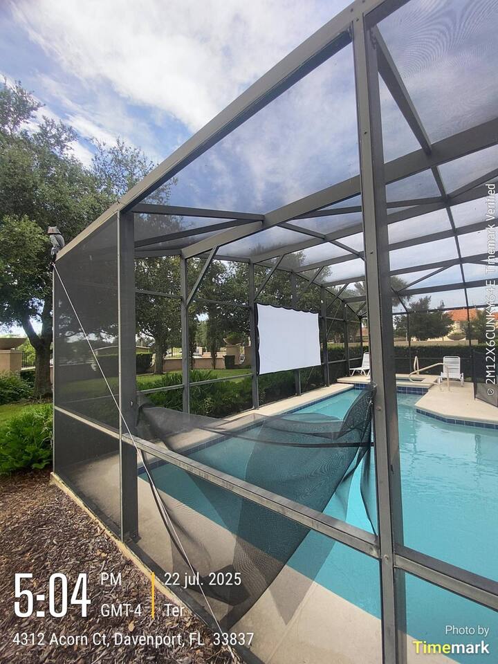 Damaged pool enclosure screens in Davenport before repair