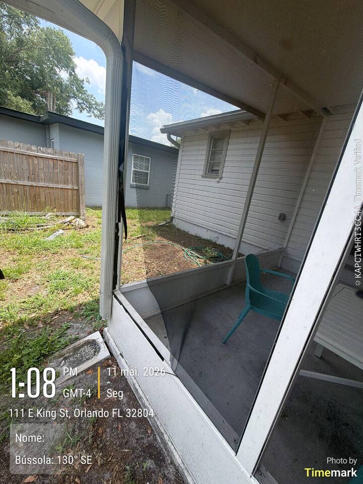 Open porch screen panel in Orlando before repair